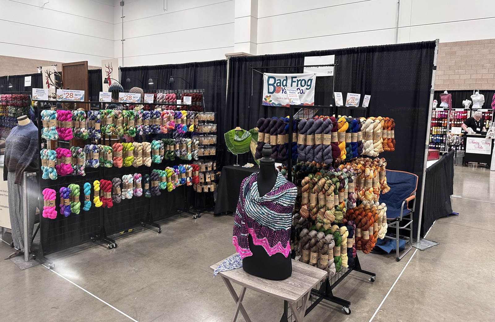 The Bad Frog Yarn Co booth at a fiber festival